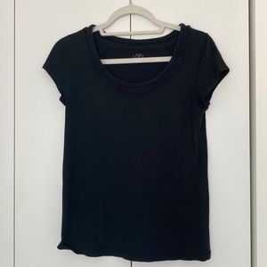 Ann Taylor Loft. Basic black tee with neck detail. Mild wear. Size medium.